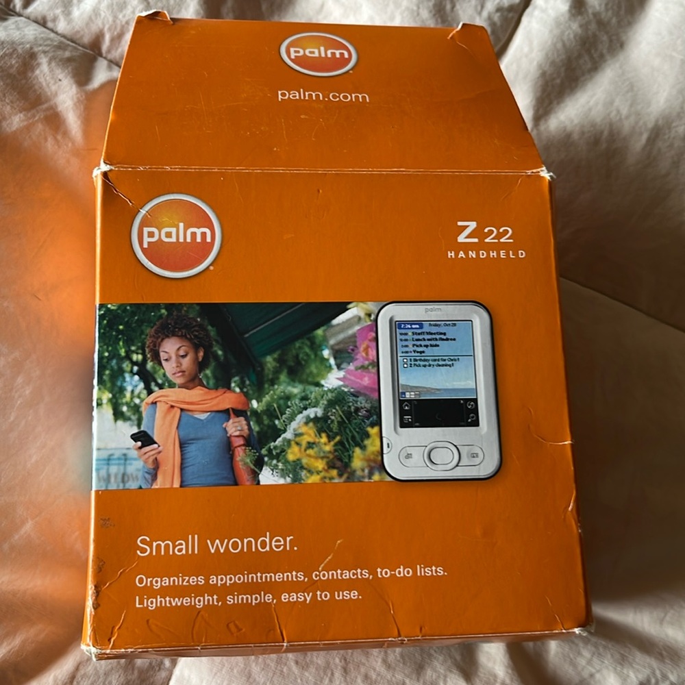 Palm handheld organizer with box.